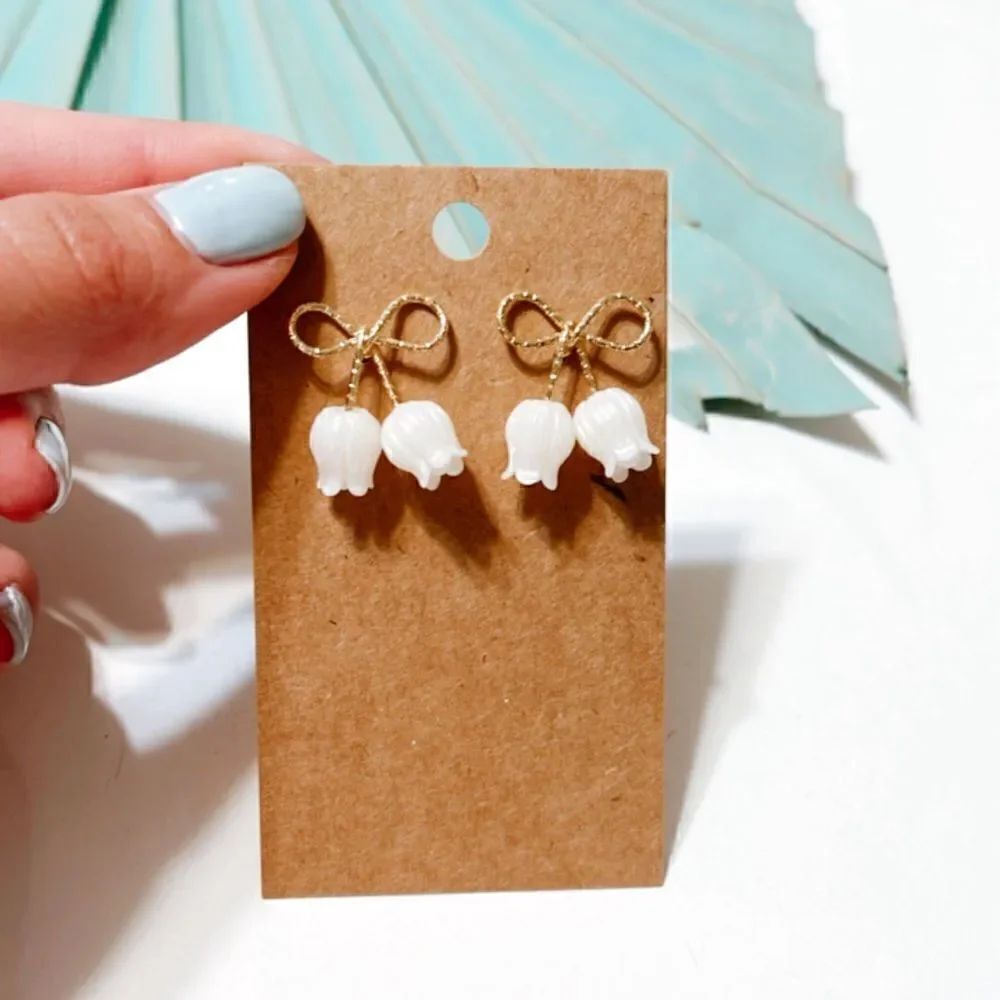 Gold bow stud earrings S110